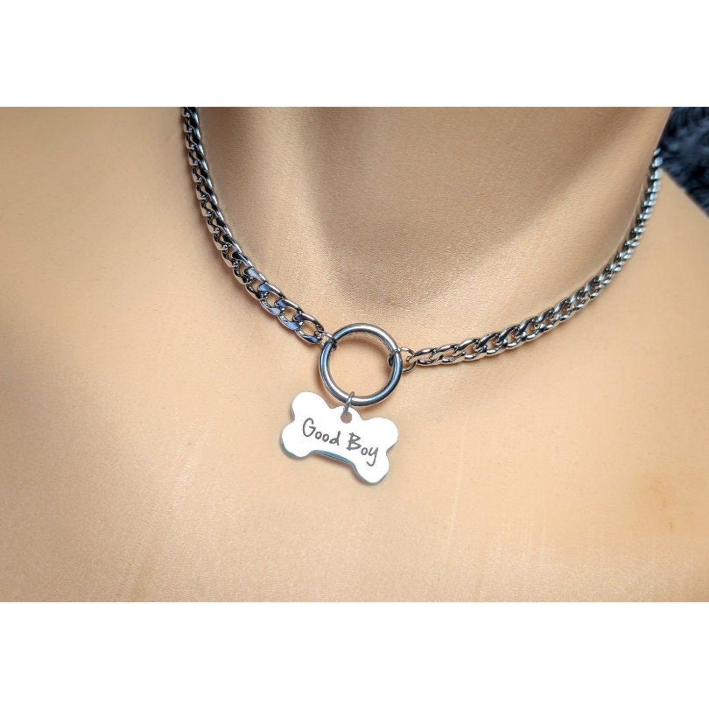 Dog Bone Charm O Ring Day Collar Engraved with Good Boy. This locking submissive day collar is suitable for 24/7 wear. Discreet locking options are available.